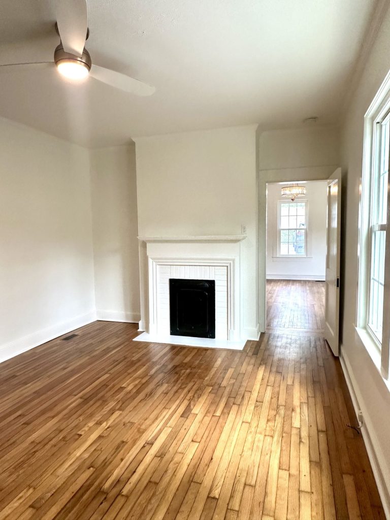 Hardwood floors and fireplace in Unit 3 at 715 1st St SE Apartments