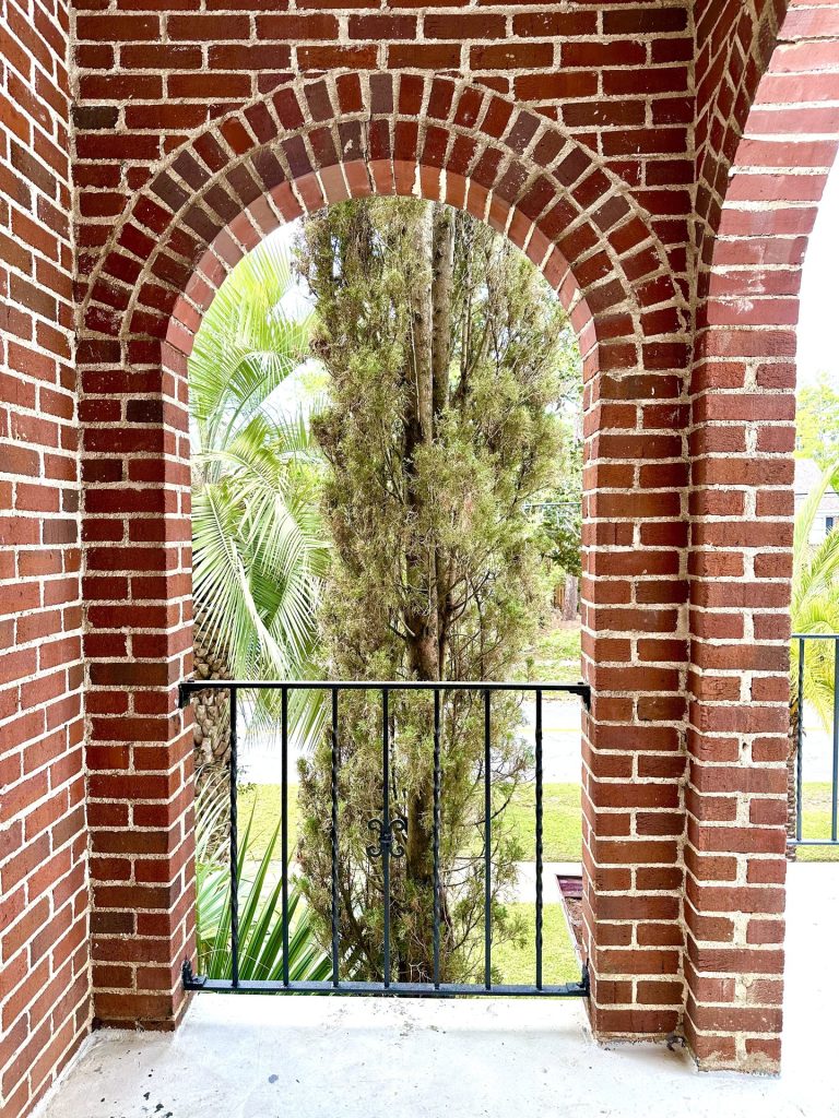Brick arch and outdoor view from Unit 5 at 715 1st St SE Apartments