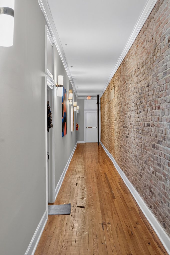 Belk Hudson Lofts exposed brick corridor, Moultrie, GA